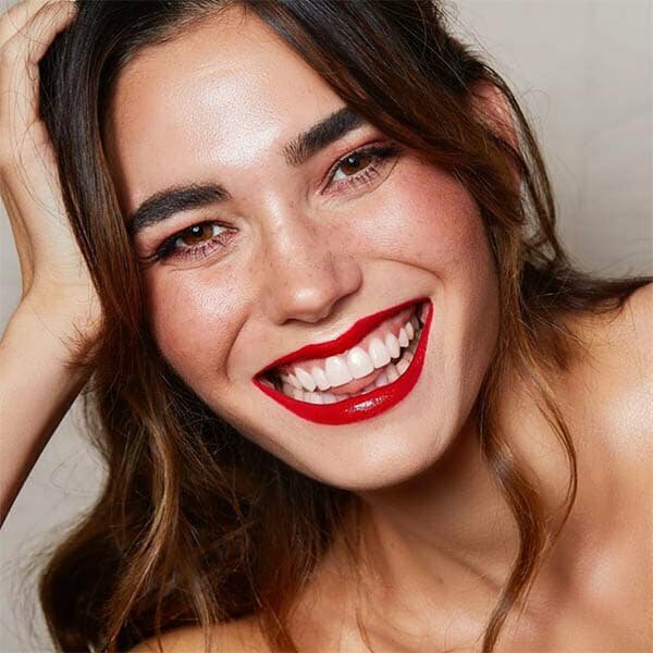 Beverly Hills Cosmetic Dentist Patient Model wearing red lipstick and smiling